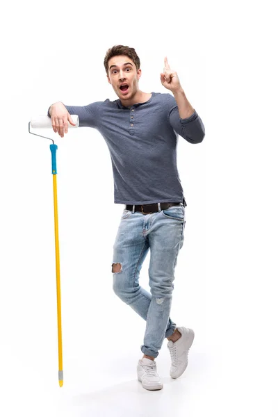 Man holding paint roller — Stock Photo