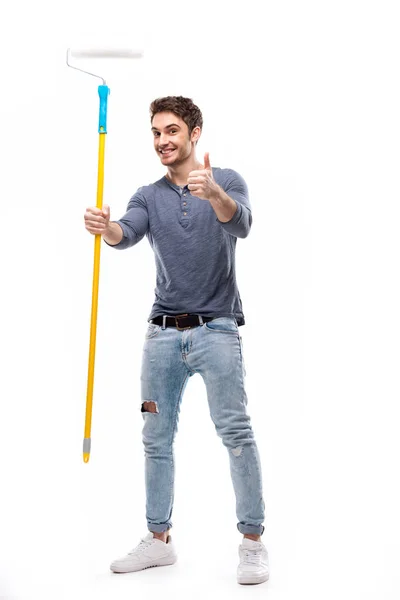 Man holding paint roller — Stock Photo