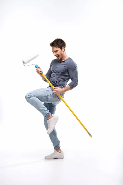 Man holding paint roller — Stock Photo