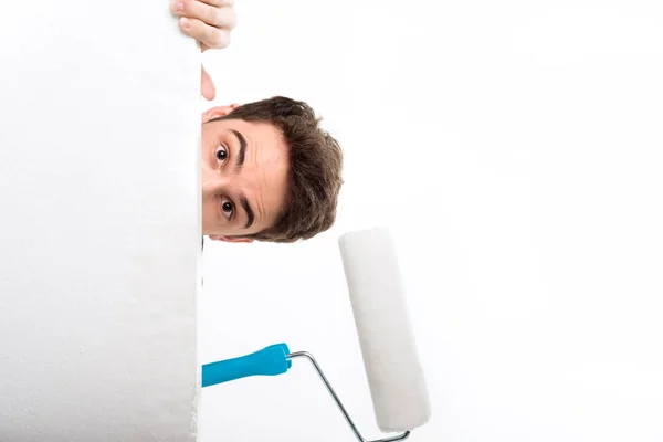 Man holding paint roller — Stock Photo