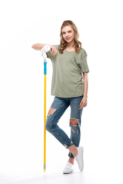 Woman holding paint roller — Stock Photo