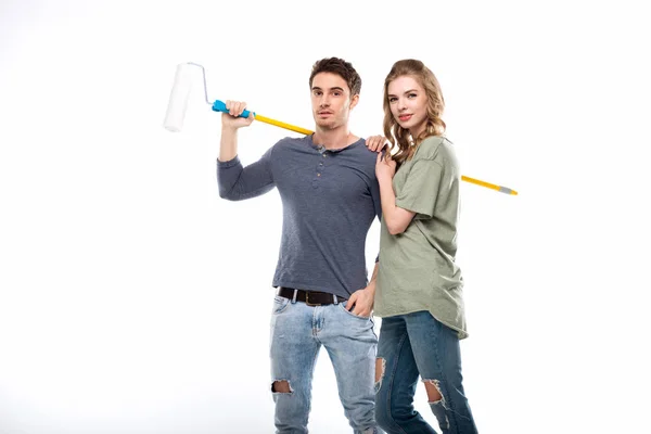 Couple holding paint roller — Stock Photo