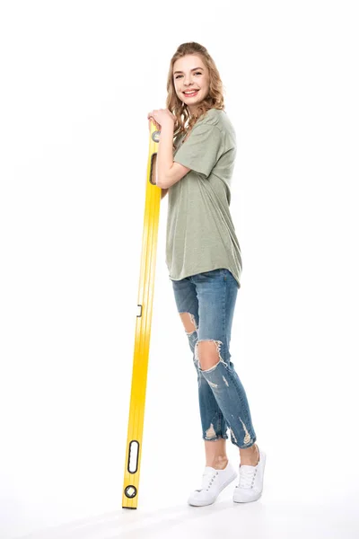 Young woman with level tool — Stock Photo