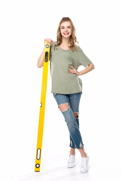 Young woman with level tool — Stock Photo