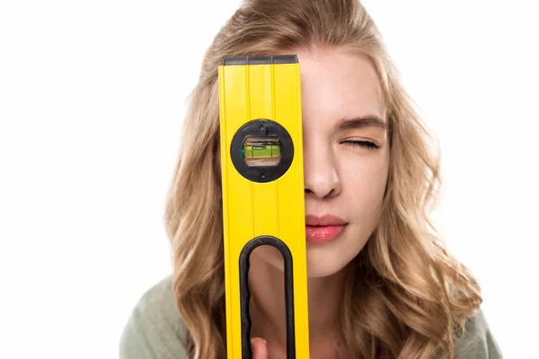 Young woman with level tool — Stock Photo