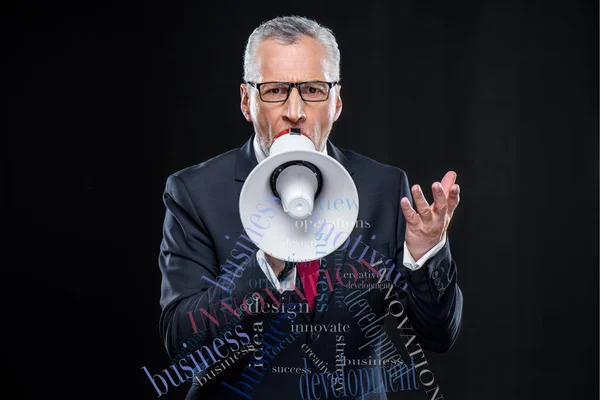 Senior businessman with loudspeaker — Stock Photo