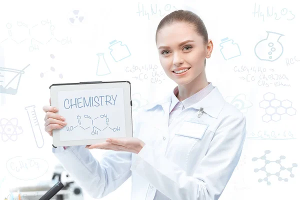 Woman scientist with digital tablet — Stock Photo