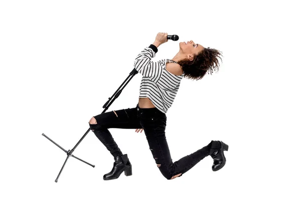 Young singer with microphone — Stock Photo