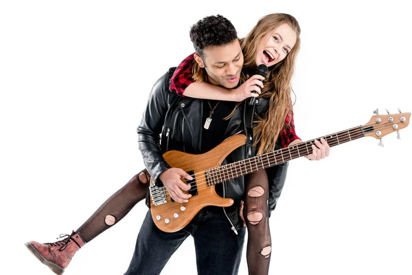 Couple with microphone and guitar — Stock Photo