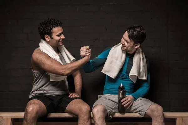 Athletes at locker room — Stock Photo