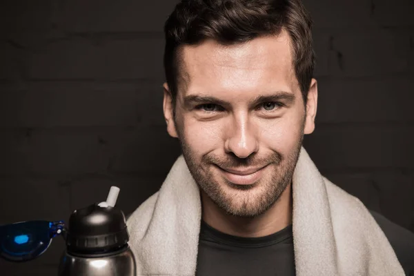 Handsome man with towel on shoulders — Stock Photo