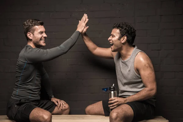 Athletes at locker room — Stock Photo