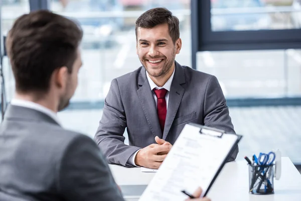 Businessmen at job interview — Stock Photo