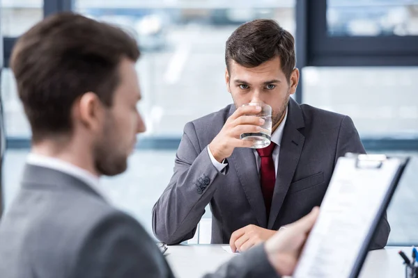 Businessmen at job interview — Stock Photo