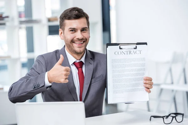 Businessman holding contract — Stock Photo