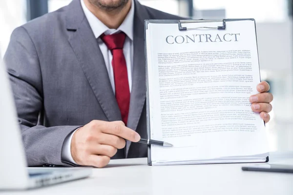 Businessman holding contract — Stock Photo