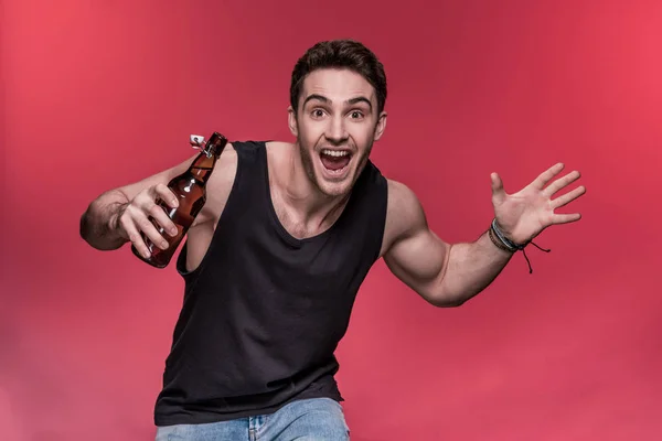 Young man with beer — Stock Photo