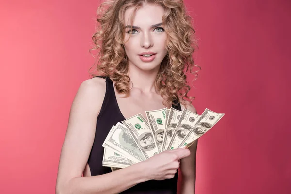 Woman holding dollars — Stock Photo