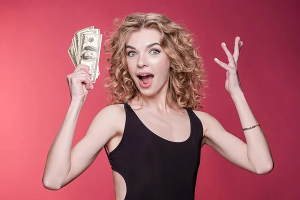 Woman holding dollars — Stock Photo