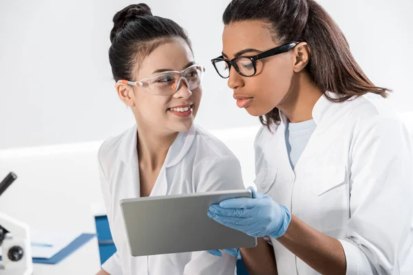 Scientists using digital tablet — Stock Photo