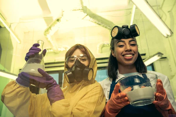 Women holding containers with reagents — Stock Photo