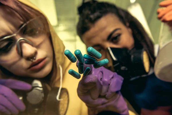 Women chemists at scientific laboratory with drugs — Stock Photo