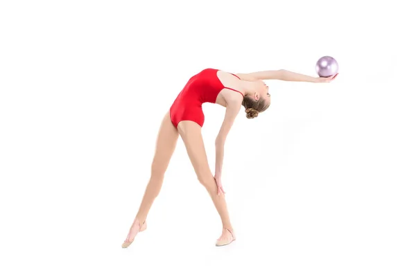 Rhythmic gymnast exercising with ball — Stock Photo