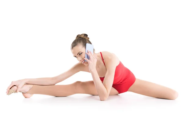 2 rhythmic gymnast talking on smartphone — Stock Photo