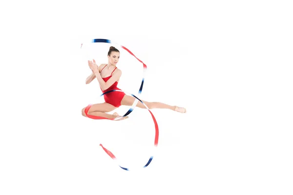 Woman rhythmic gymnast jumping with rope — Stock Photo