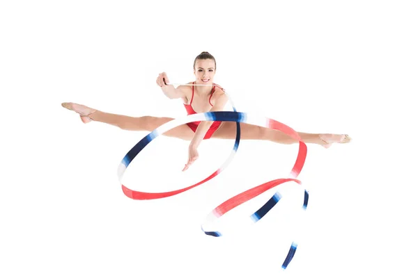 Woman rhythmic gymnast jumping with rope — Stock Photo