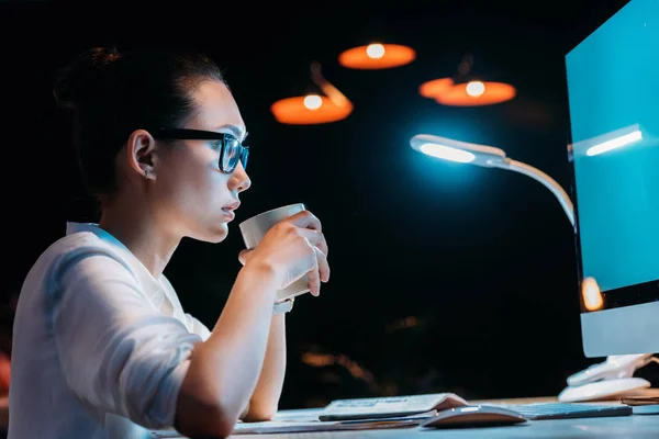 Businesswoman working late in office — Stock Photo