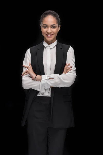 Confident businesswoman standing with arms crossed — Stock Photo