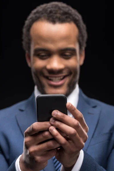 Businessman using smartphone — Stock Photo