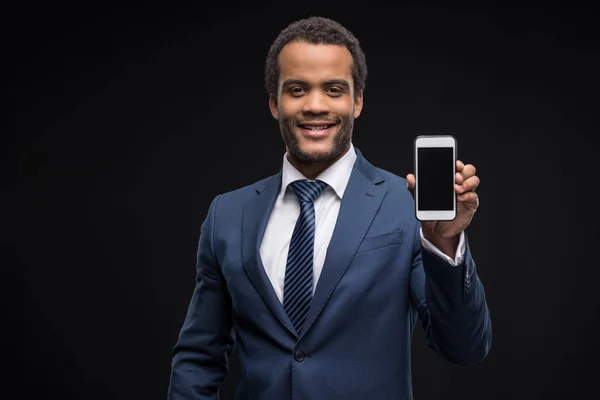 Businessman using smartphone — Stock Photo