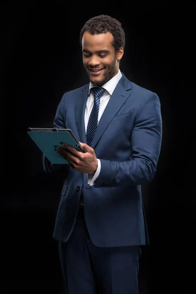 Businessman using digital tablet — Stock Photo