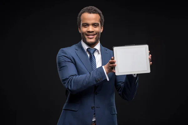 Businessman using digital tablet — Stock Photo