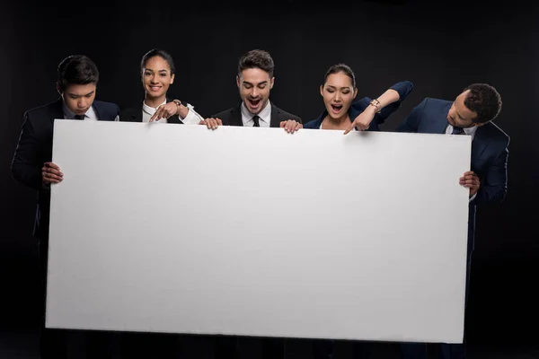 Business people with blank billboard — Stock Photo