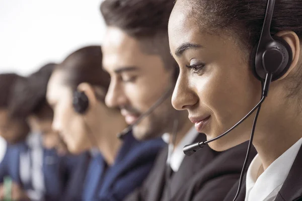 Call center operators in headsets — Stock Photo