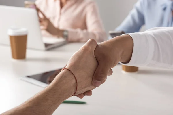 Business colleagues shaking hands — Stock Photo