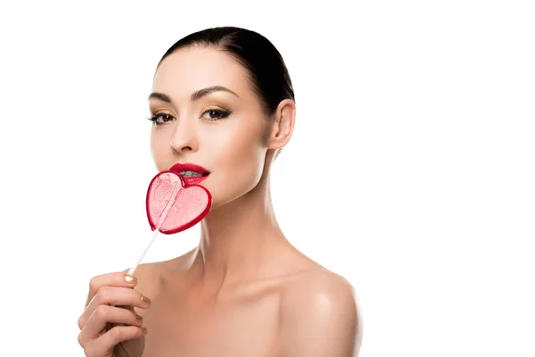 Woman with heart shaped lollipop — Stock Photo