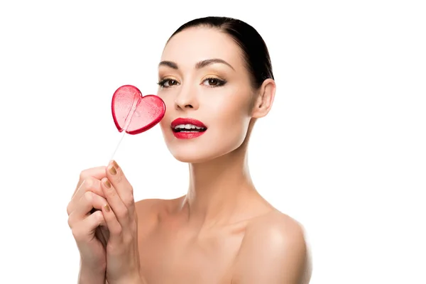 Woman with heart shaped lollipop — Stock Photo