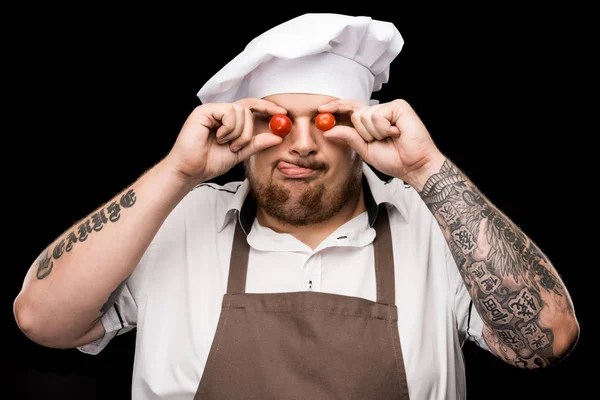 Chef segurando tomates cereja — Fotografia de Stock