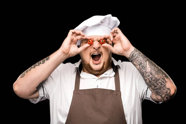 Chef segurando tomates cereja — Fotografia de Stock