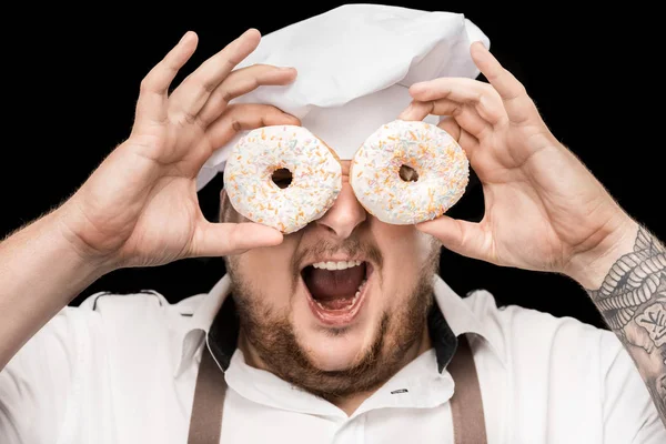 Koch hält Donuts in der Hand — Stockfoto