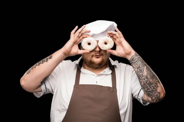 Koch hält Donuts in der Hand — Stockfoto