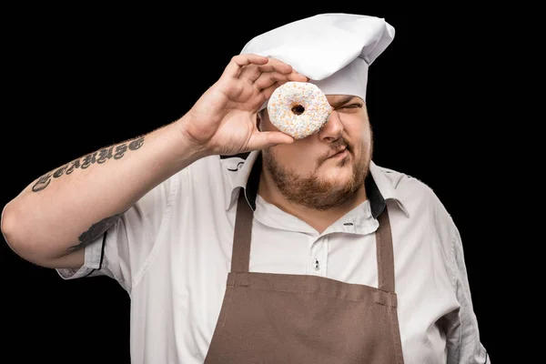 Koch hält Donut in Händen — Stockfoto