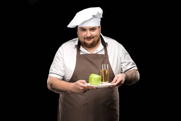 Cuisinière avec jus de pomme — Photo de stock