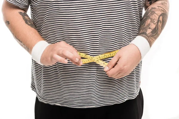 Man measuring waist volume with tape — Stock Photo