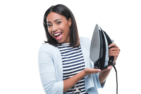 Young woman holding iron — Stock Photo
