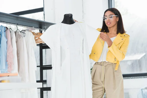 Dressmaker working with dummy — Stock Photo